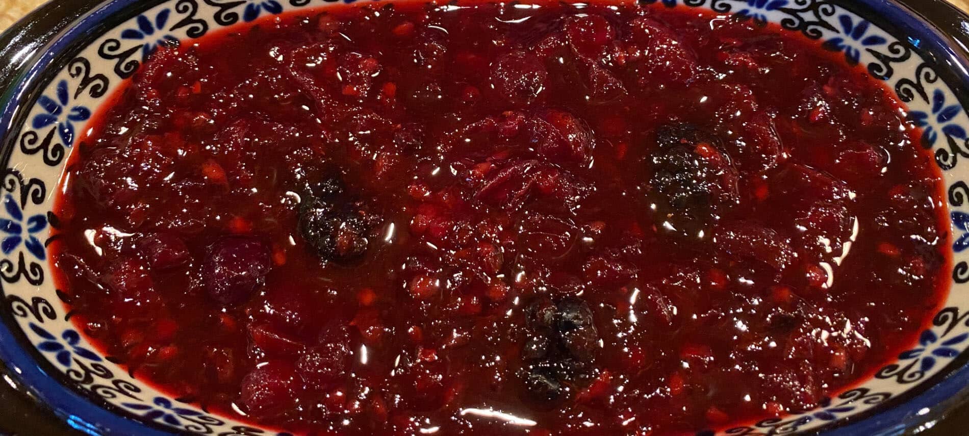 Deep red cranberry sauce with purple blackberries