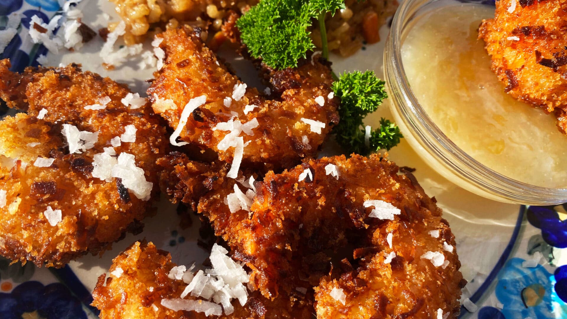 Crispy Golden Fried Coconut Shrimp with a yellow pina colada dipping sauce