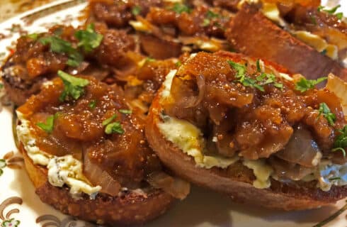 Toasted Crostini topped with melted white Gorgonzola cheese, golden caramelized onions, and sweet fig jam