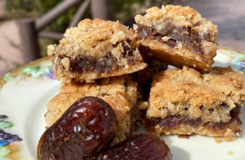 Golden Oat cookies filled with a sweet date filling, garnished with additional dates