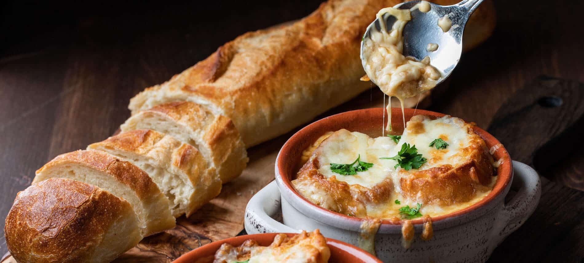 French Onion Soup with Crispy Baguette and melted cheese