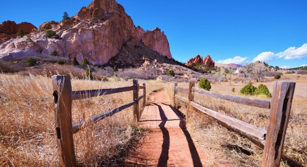 red rock formations with a walking path through the park
