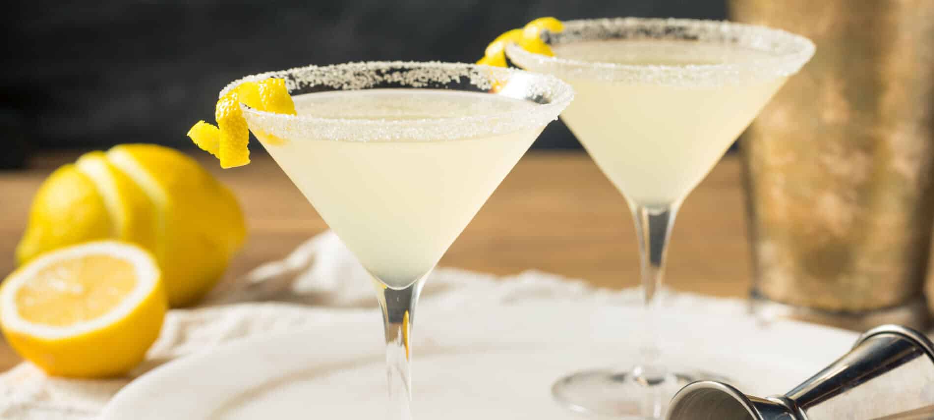 Yellow lemon Martini in clear glasses with lemons