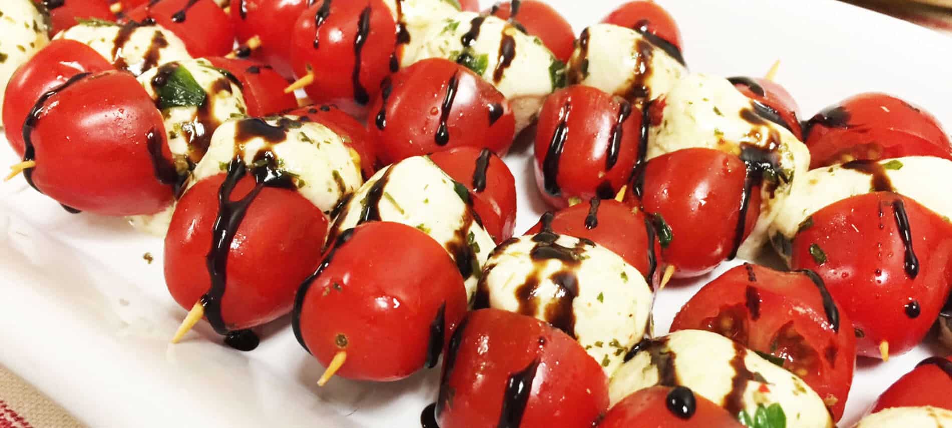 Mozzarella balls and cherry tomato kebabs with a balsamic glaze