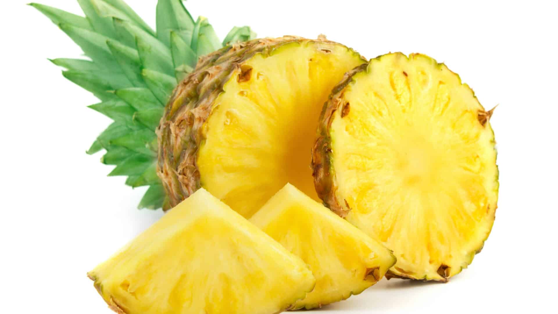 Fresh pineapple cut into slices and wedges