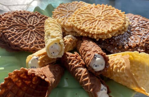 Chocolate and Golden crispy Pizzelle cookies, cream filled canoli and cones