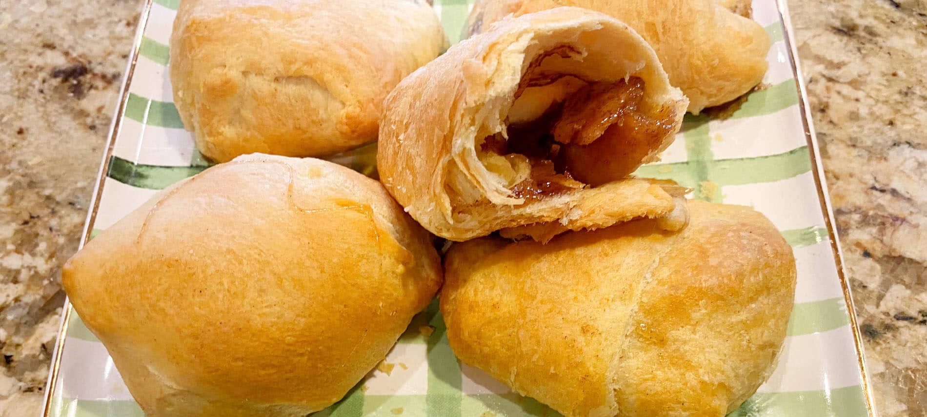 Golden crescent rolls filled with melted marshmallows, cinnamon and sugar