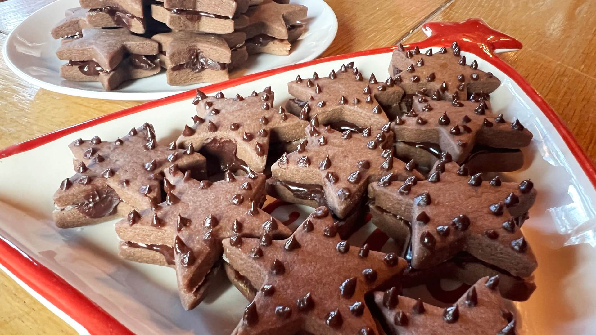 Plates filled with chocolate sandwich cookies with a fudgey filling.