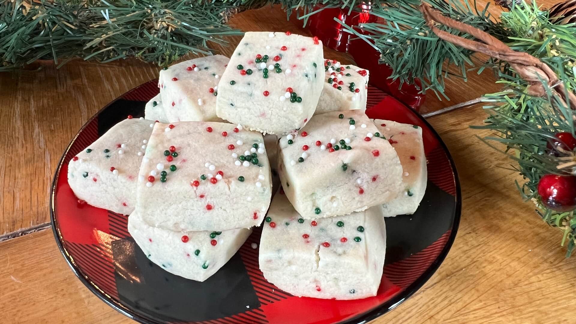 White shortbread cookie squares filled with red, white and green sprinkles.