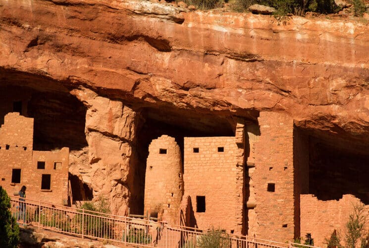 Sandstone Indian cliff dwellings built into the sides of red rocks