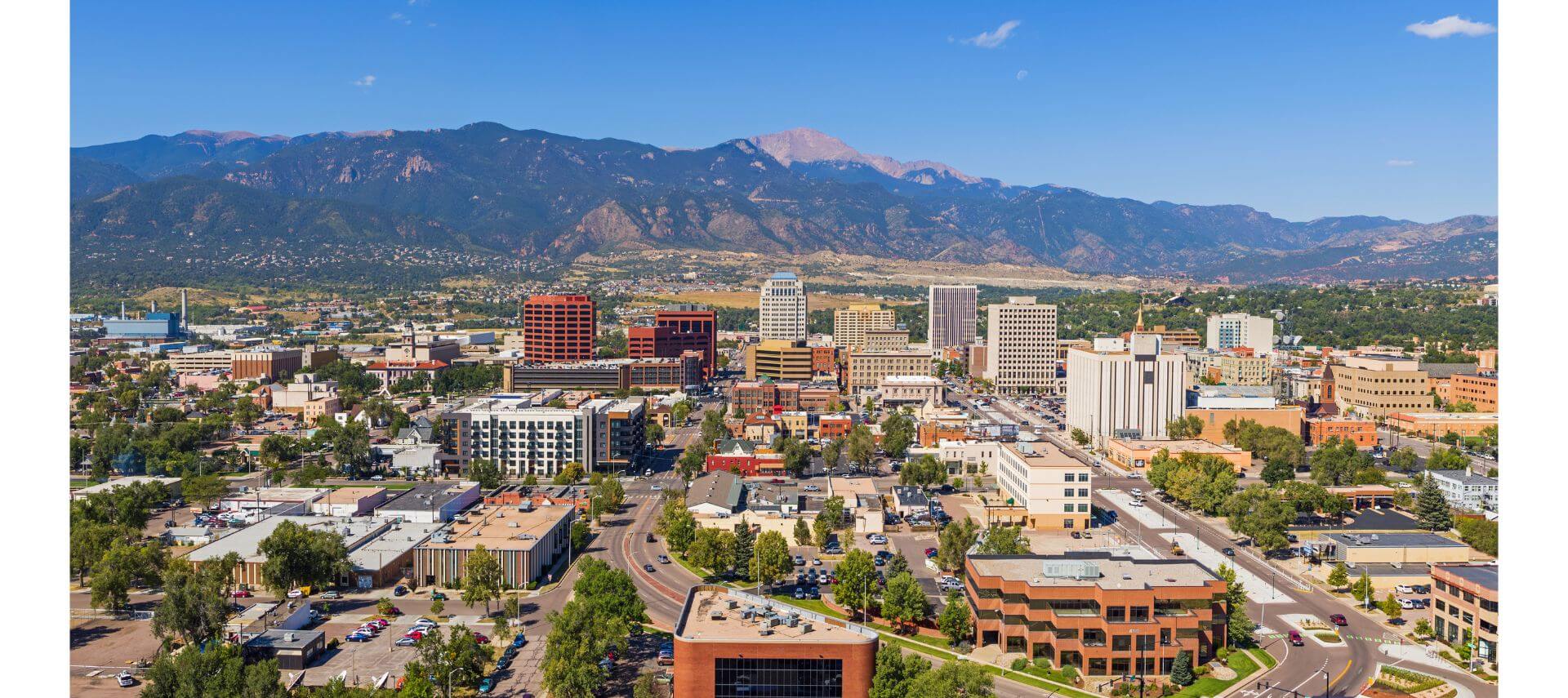 city of Colorado Springs with mountains in the background