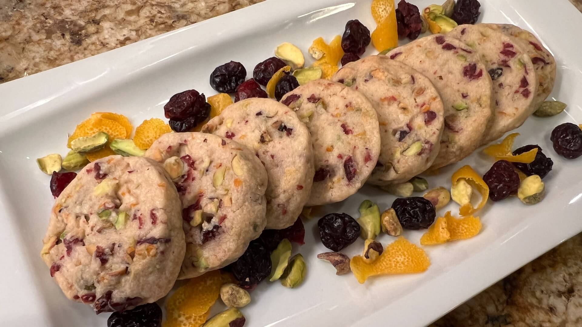 Round shortbread cookies filled with dried cranberries, pistachios and orange zest.