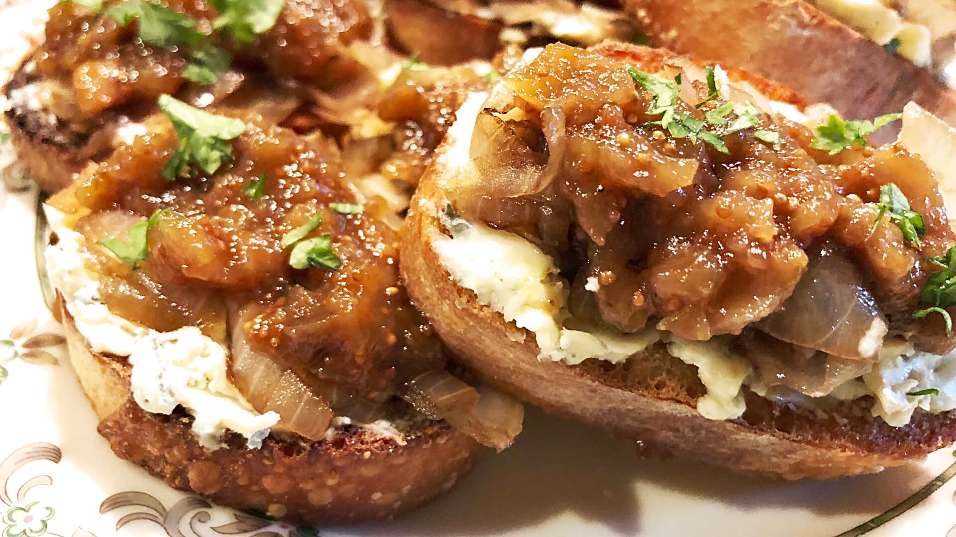 toasted baguette slices topped with creamy gorgonzola cheese, fig jam and caramelized onions