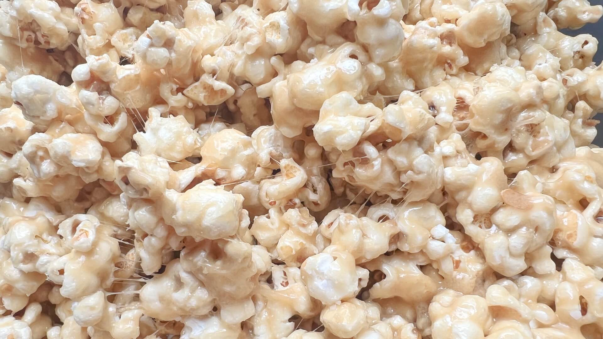 popcorn covered in a sticky gooey marshmallow sauce