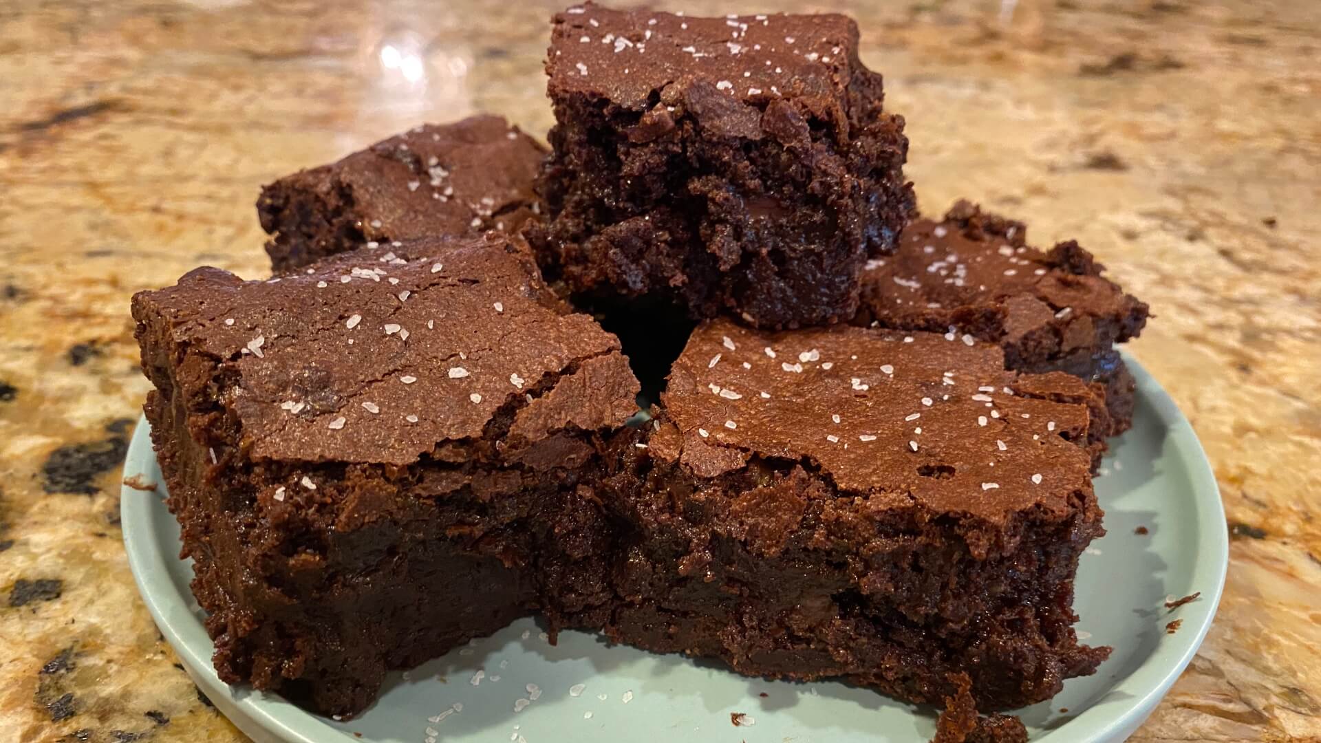 rich chocolate brownies with sprinkles of sea salt on top.